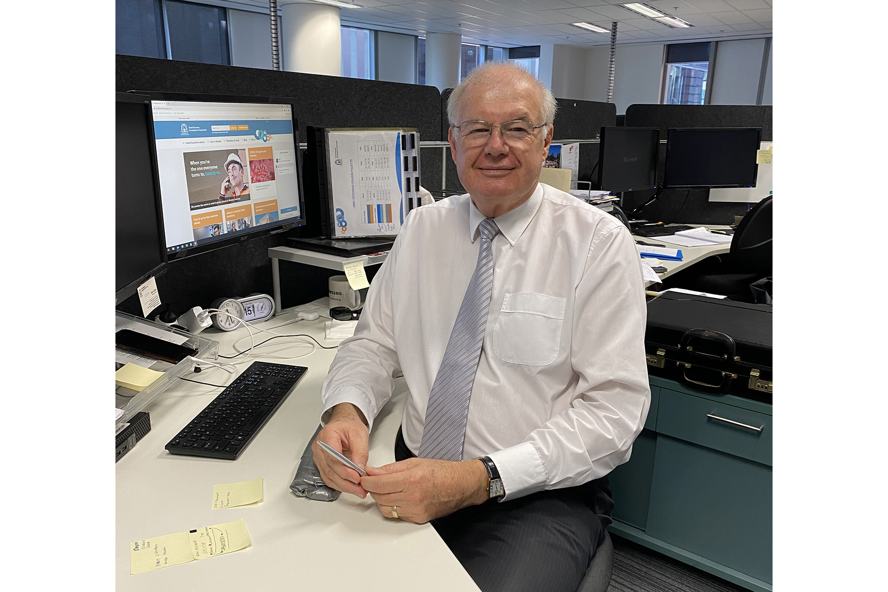Photo of SBDC Business Adviser Brian Childs sitting at his desk in the SBDC's office in the Perth CBD.