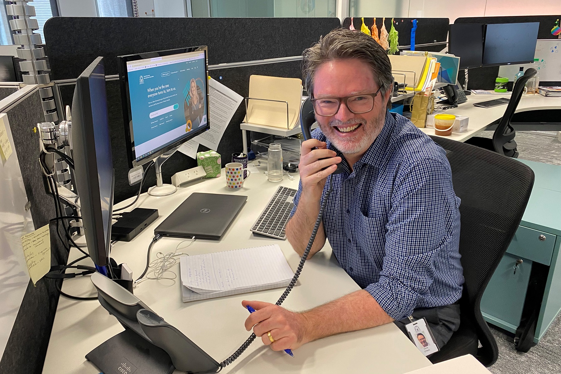 Photo of SBDC Business Adviser Chris O'Hare sitting at his desk in the SBDC's office in the Perth CBD.
