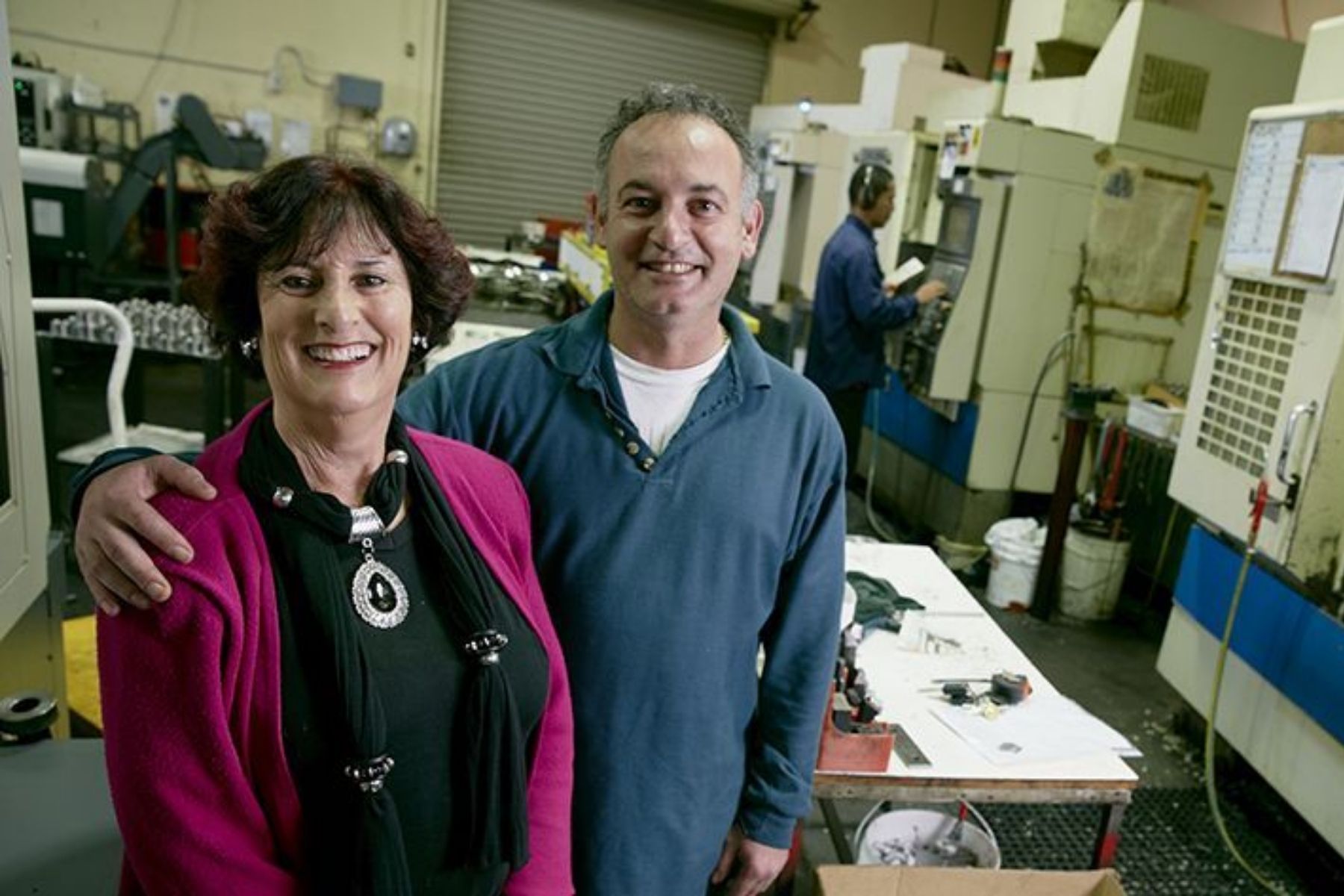 Photo of two business owners in their factory.