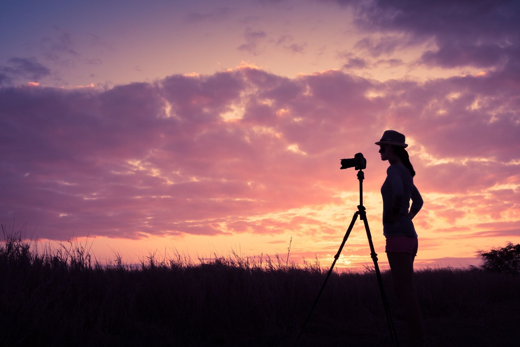 Image of a photographer taking a photo at dusk
