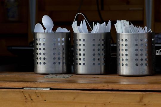 Photo of disposable cutlery in a cutlery holder.